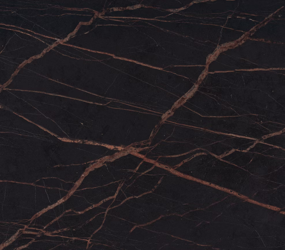 Dekton Laurent slab with dark background and gold veins